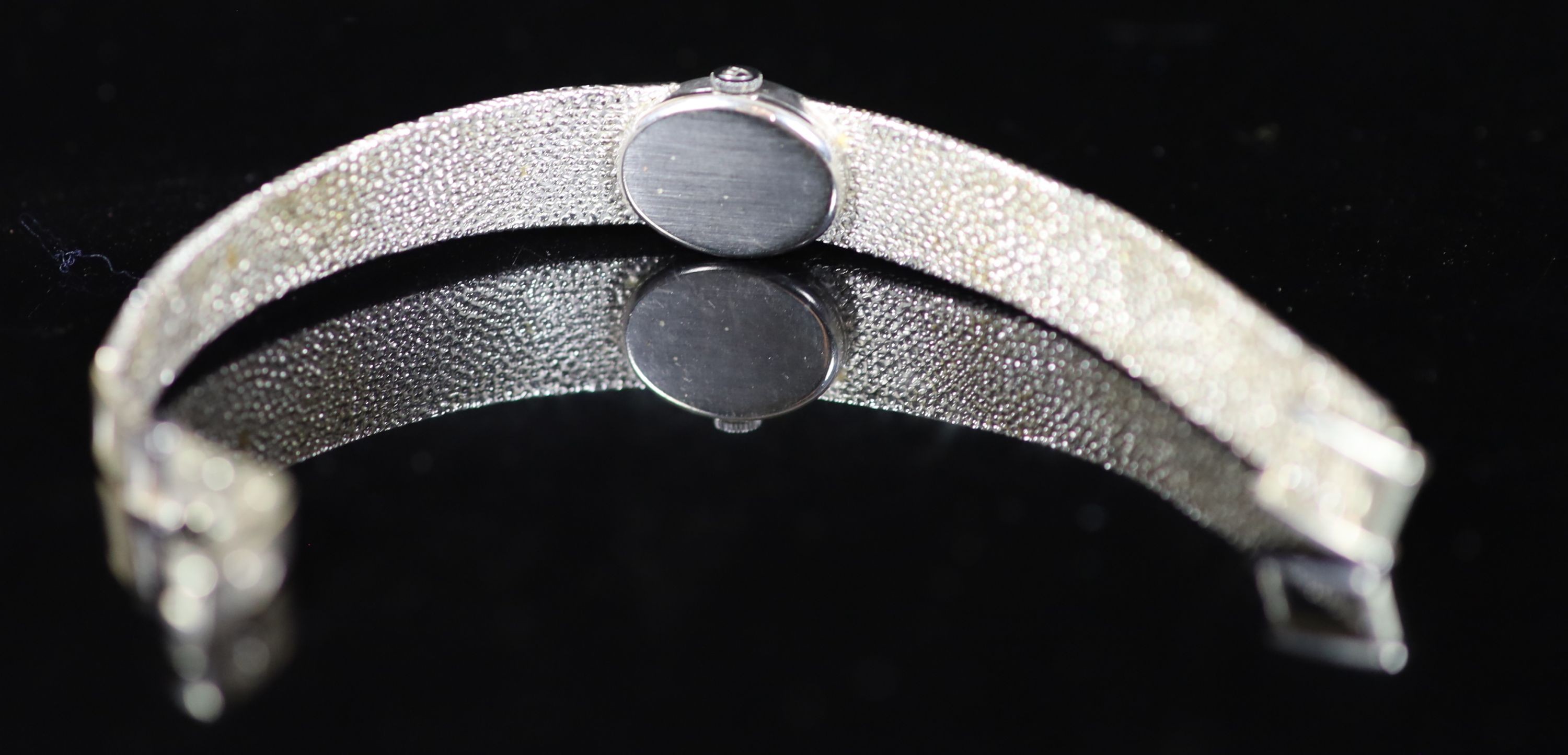A lady's 9ct white gold Tudor manual wind oval wrist watch